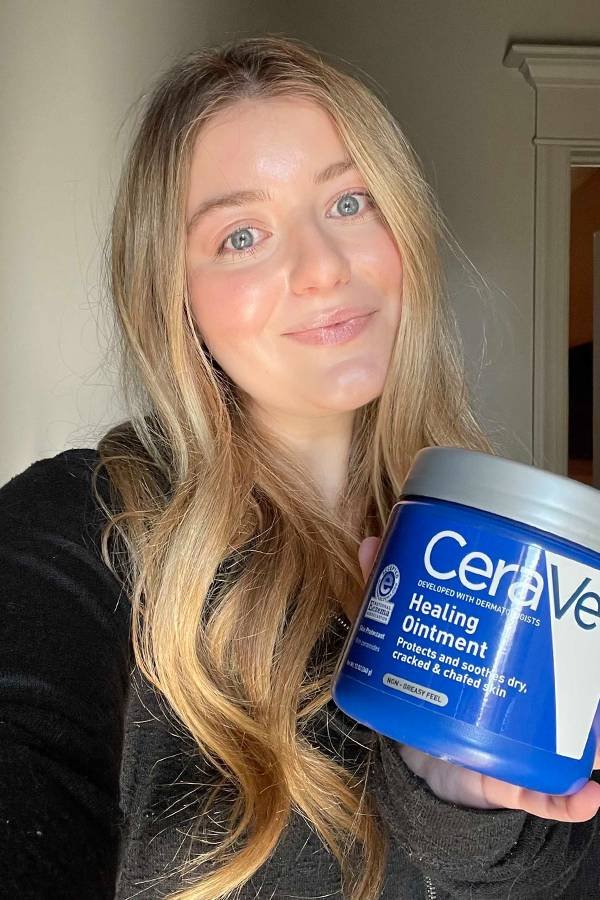 Model holding CeraVe Healing Ointment Product Container