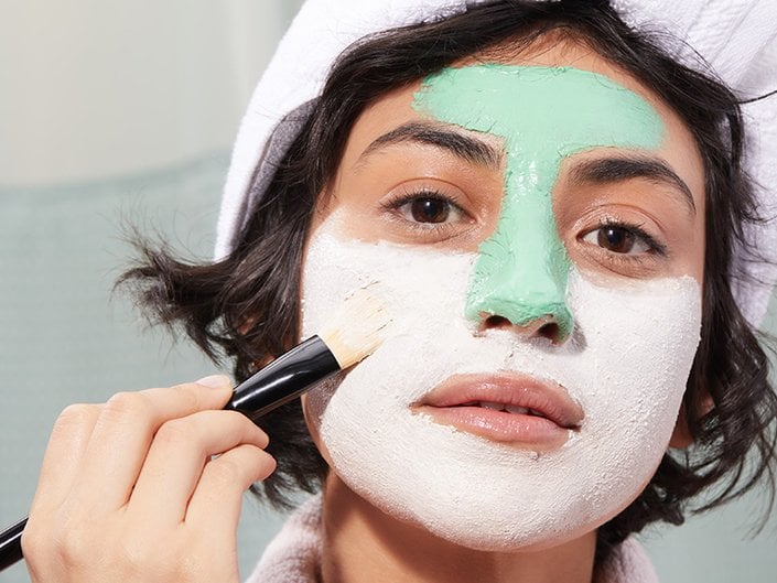 person applying face mask