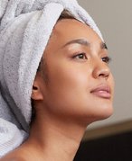 Person with towel wrapped around their hair