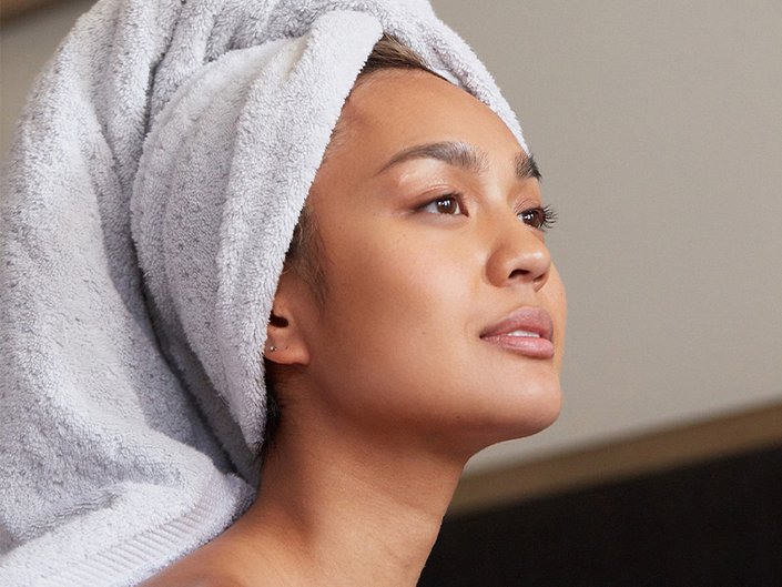 Person with towel wrapped around their hair