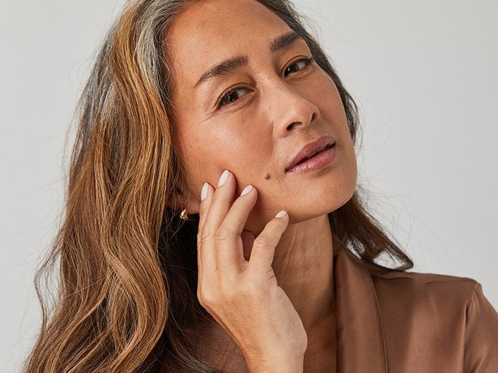 woman touching face