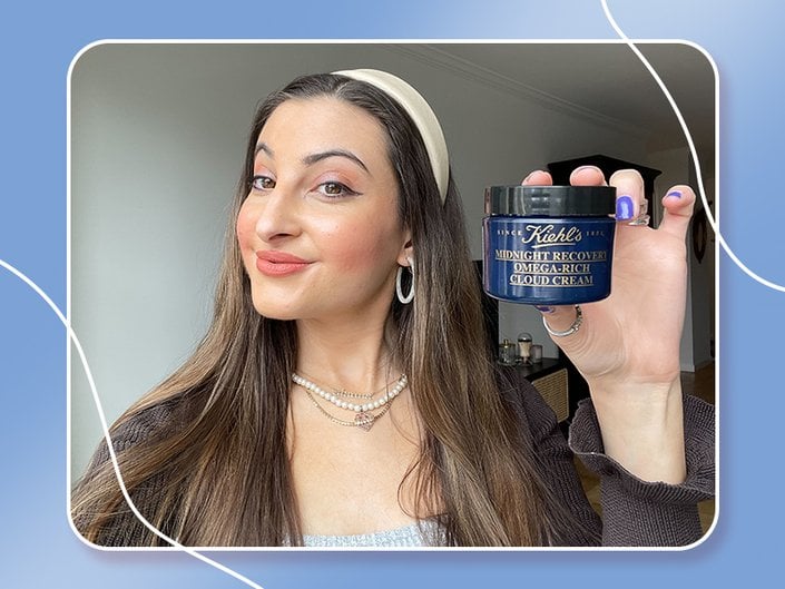 person holding the kiehls cloud cream