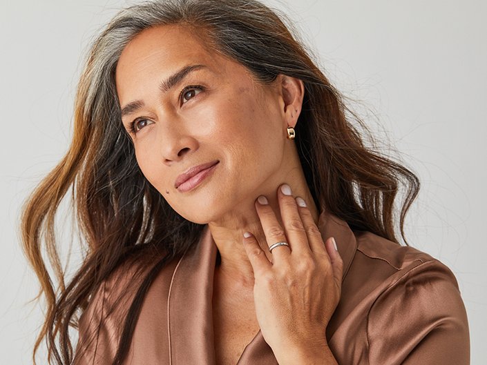 person posing with hand on neck