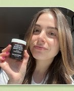 person holding yerba mate mask in sunlight