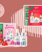 IT Cosmetics Beautiful Together Serums Solutions Gift Set and Kiehl's Brighten Up & Glow Skincare Holiday Gift Set on a muted red background