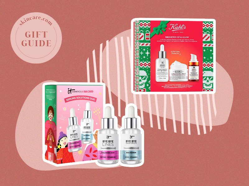 IT Cosmetics Beautiful Together Serums Solutions Gift Set and Kiehl's Brighten Up & Glow Skincare Holiday Gift Set on a muted red background