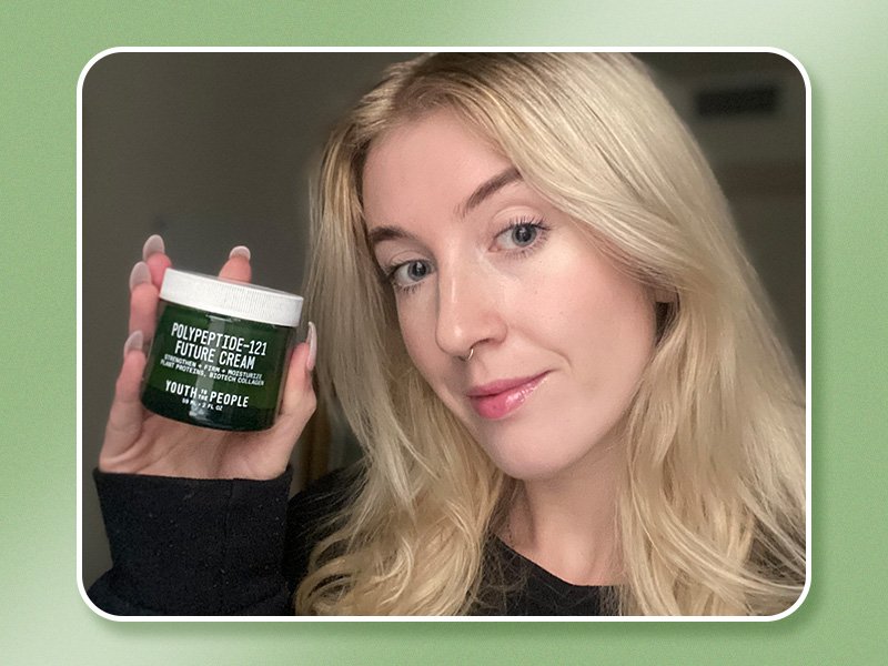 Image of a blonde woman holding the Youth to The People Polypeptide 121 Future Cream on a green graphic background