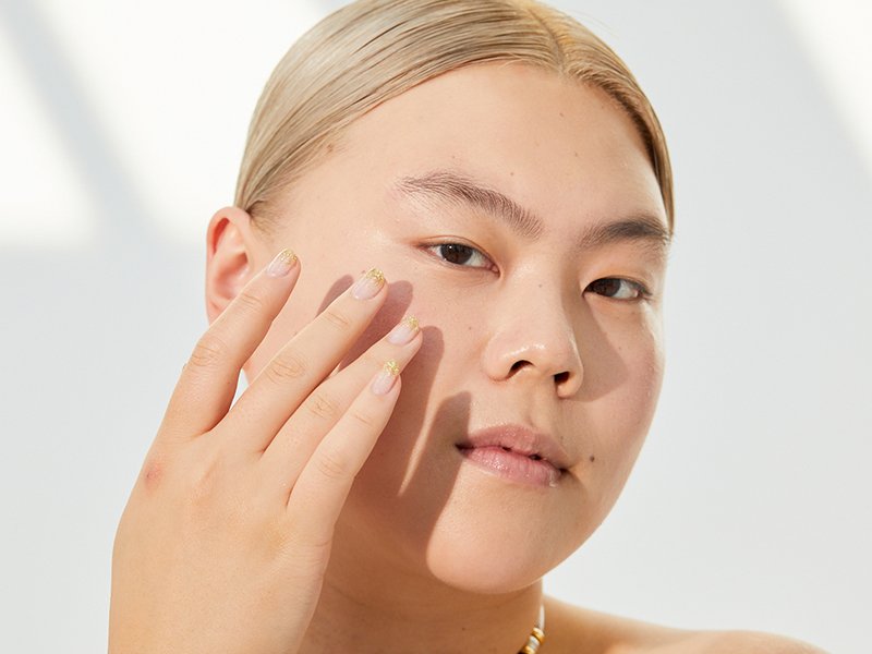 Picture of a model applying eye cream