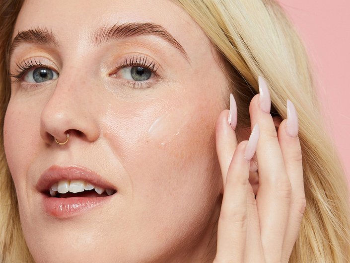 Picture of an editor touching the side of their face
