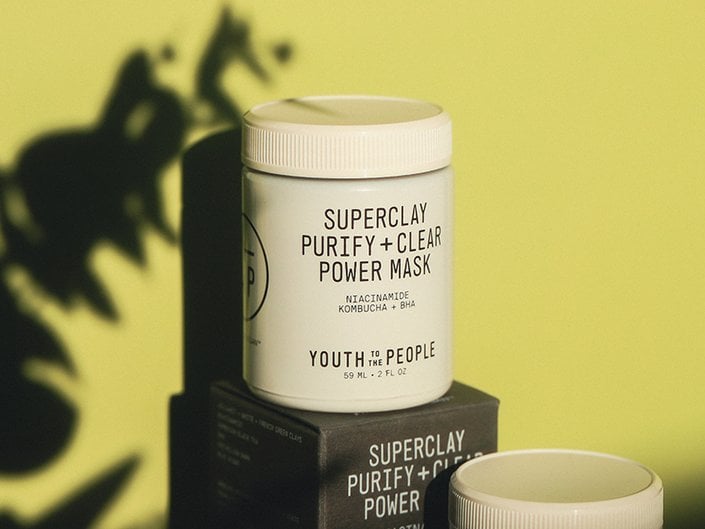 Youth to the People Superclay Purify + Clear Power Mask against a lime green background