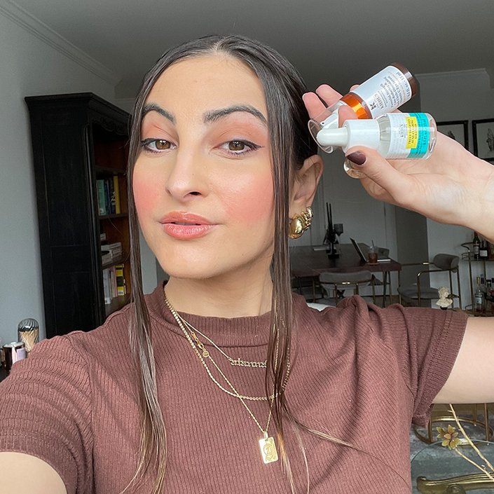 alanna holding the kiehls truly targeted serum and the kiehls vitamin c eye serum