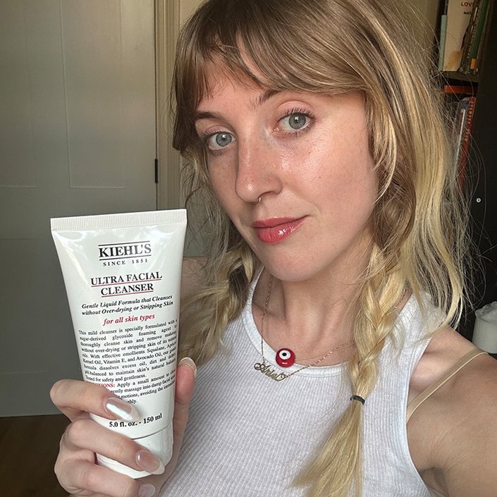 ari holding the kiehls ultra facial cleanser