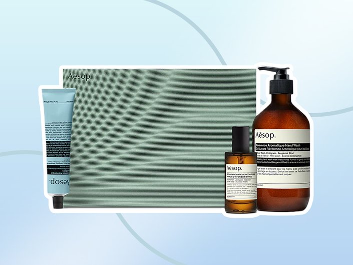 aesop winter skincare set and moisturizer collaged onto a blue background