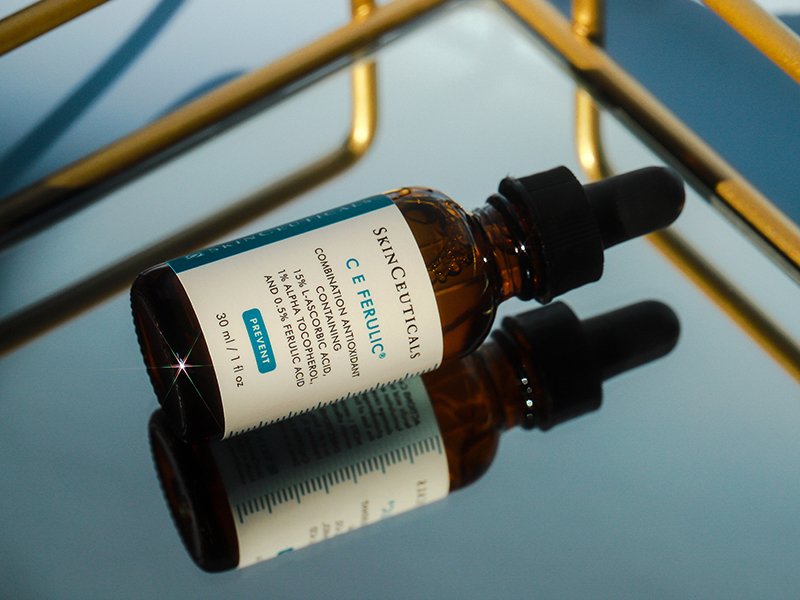 Bottle of the SkinCeuticals C E Ferulic Serum turned over on a mirrored counter