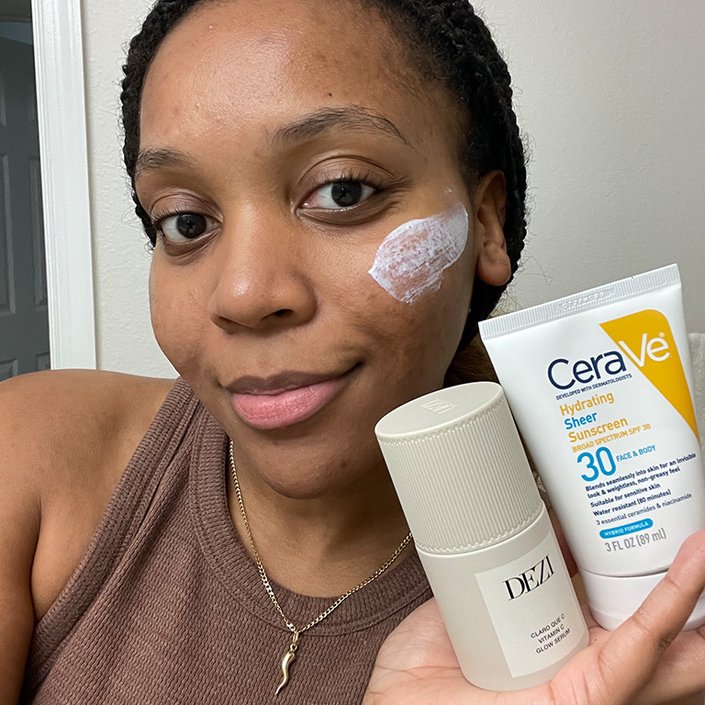 kat posing with the dezi skin serum and the CeraVe Hydrating Sheer Sunscreen