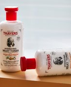Picture of two Thayers toners laying on a wooden beam