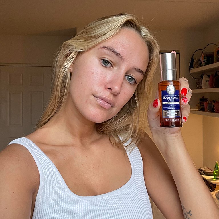 Jordan holds up a bottle of the IT Cosmetics Confidence in Your Beauty Sleep Triple Antioxidant Brightening Serum