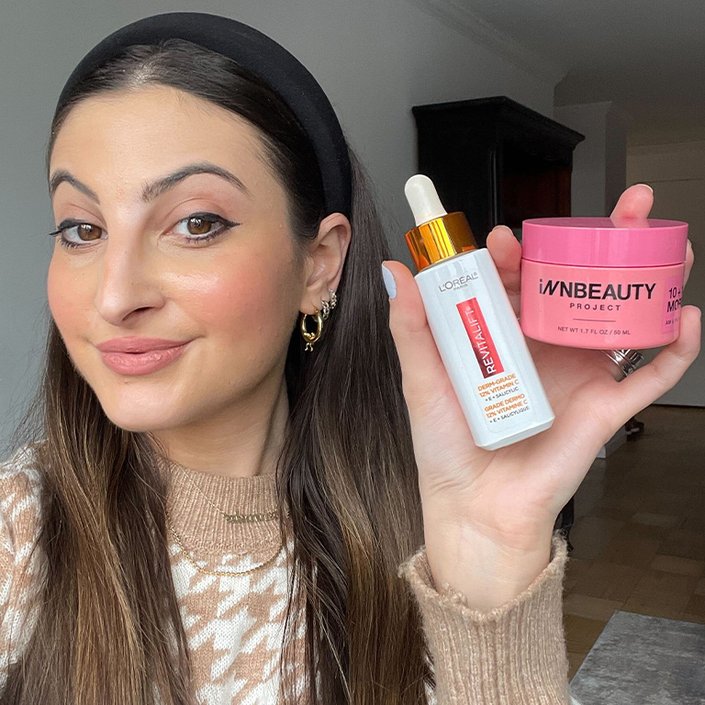 alanna holding the loreal paris vitamin c serum and the innbeauty project moisturizer