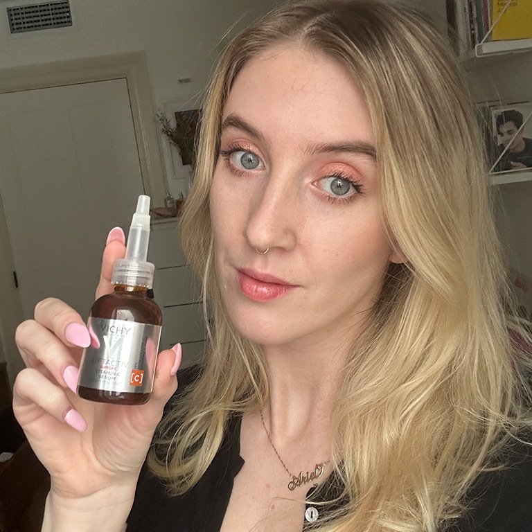ari holding the vichy vitamin c serum
