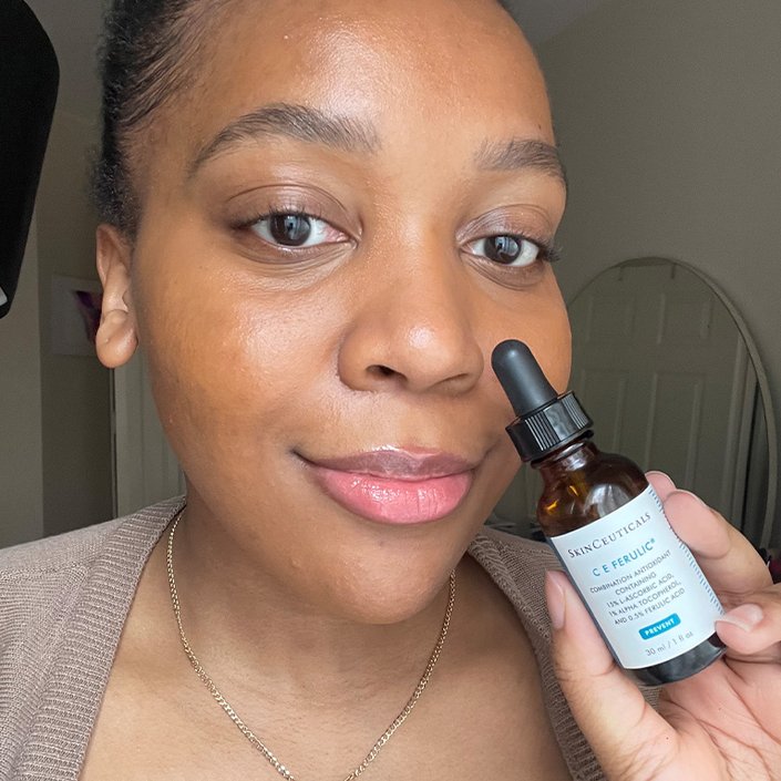 kat holding the SkinCeuticals C E Ferulic Acid Serum