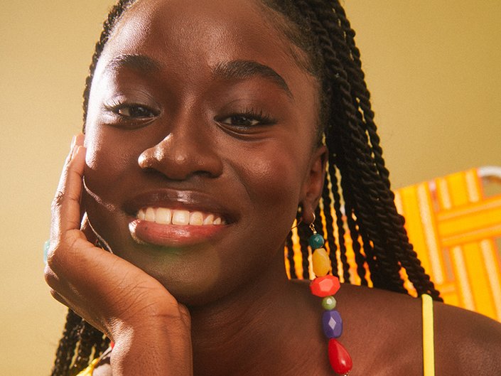 Picture of a model smiling and looking at the camera
