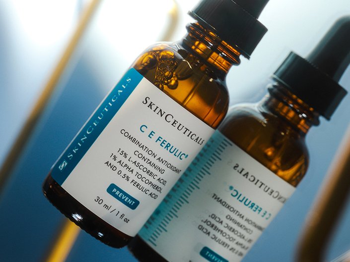 SkinCeuticals CE Ferulic Serum lying on a mirrored surface