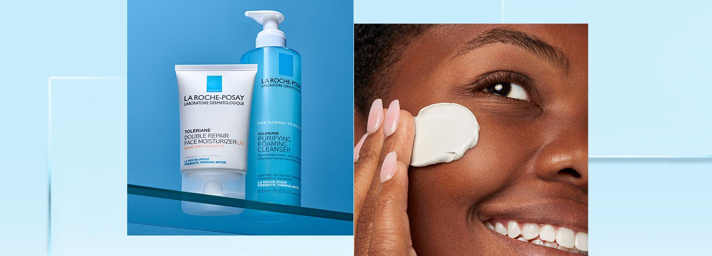 A woman rubbing a lotion into her face