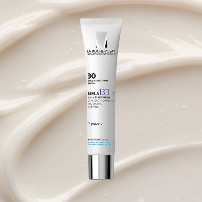2026_SDC_LRPAntheliosDailyMoisturizer: La Roche-Posay Anthelios Mela B3 UV Daily Moisturizer on a cream textured background