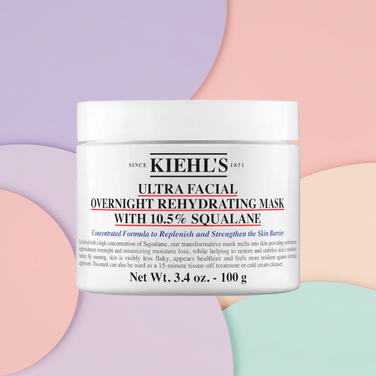 Bottle of Kiehl’s Ultra Facial Overnight Rehydrating Mask with 10% Squalane on a textured background