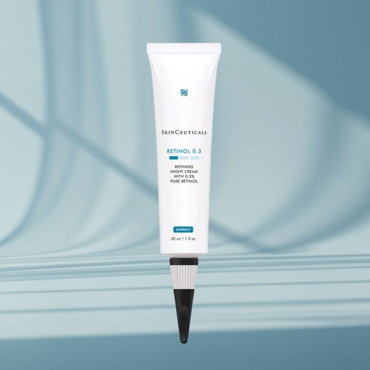 SkinCeuticals Retinol 0.3 cream on a blue textured background